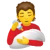 Person Feeding Baby
