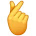 Hand mit gekreuztem Zeigefinger und Daumen
